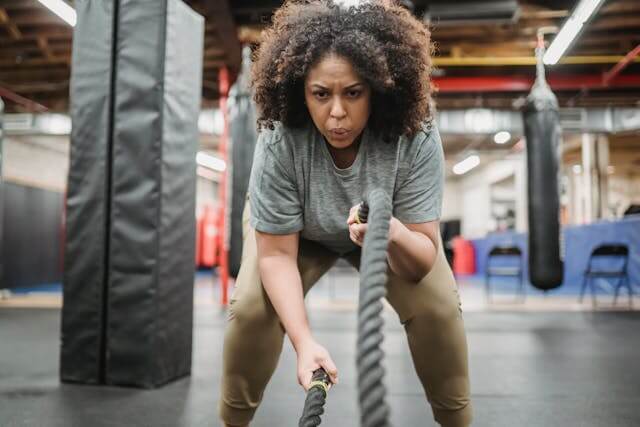 Why am I not losing weight? Woman performing rope exercises.